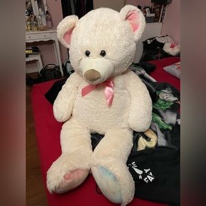 huge teddy bear in pink and white